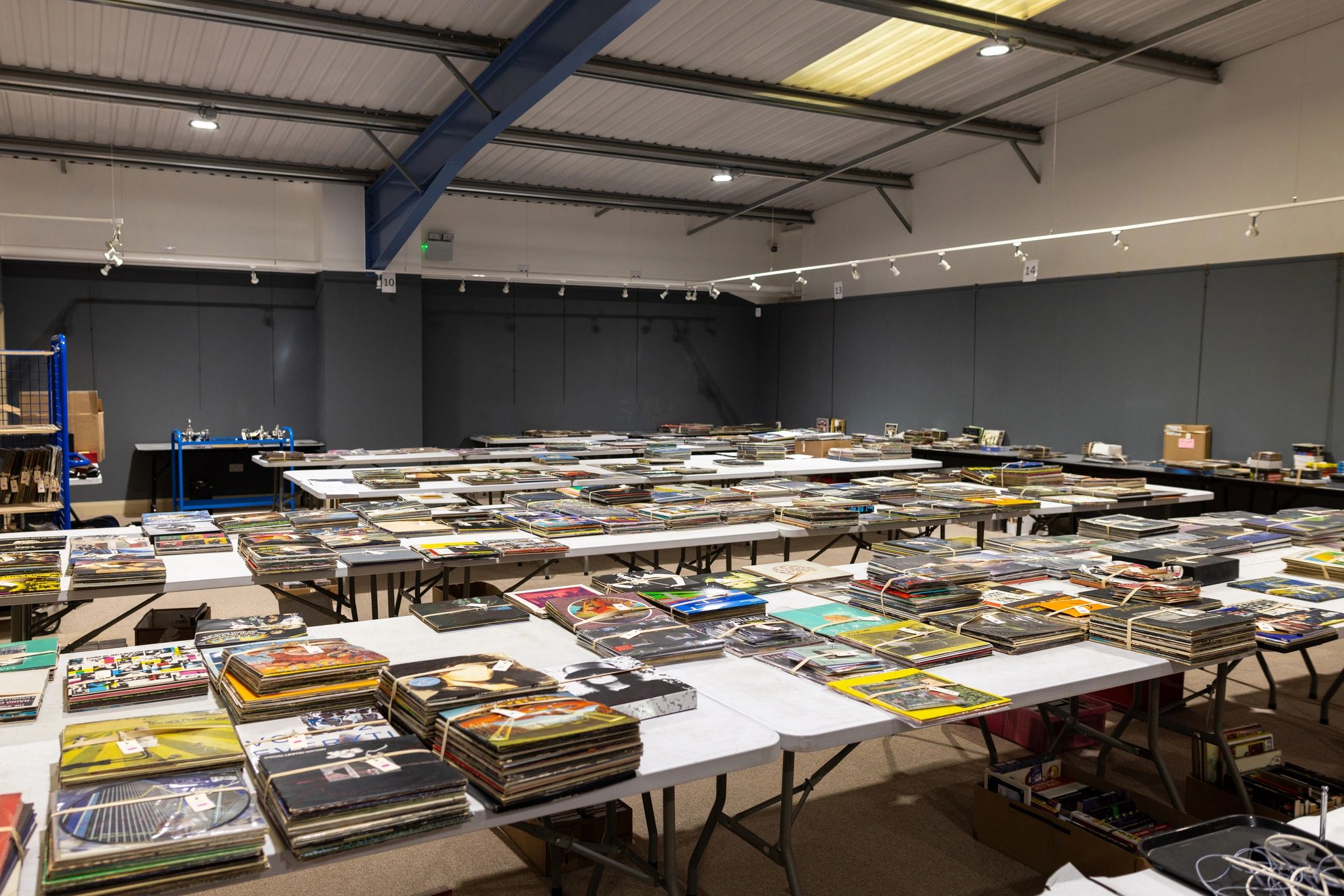 Rows of tables with collectibles laid out for browsing