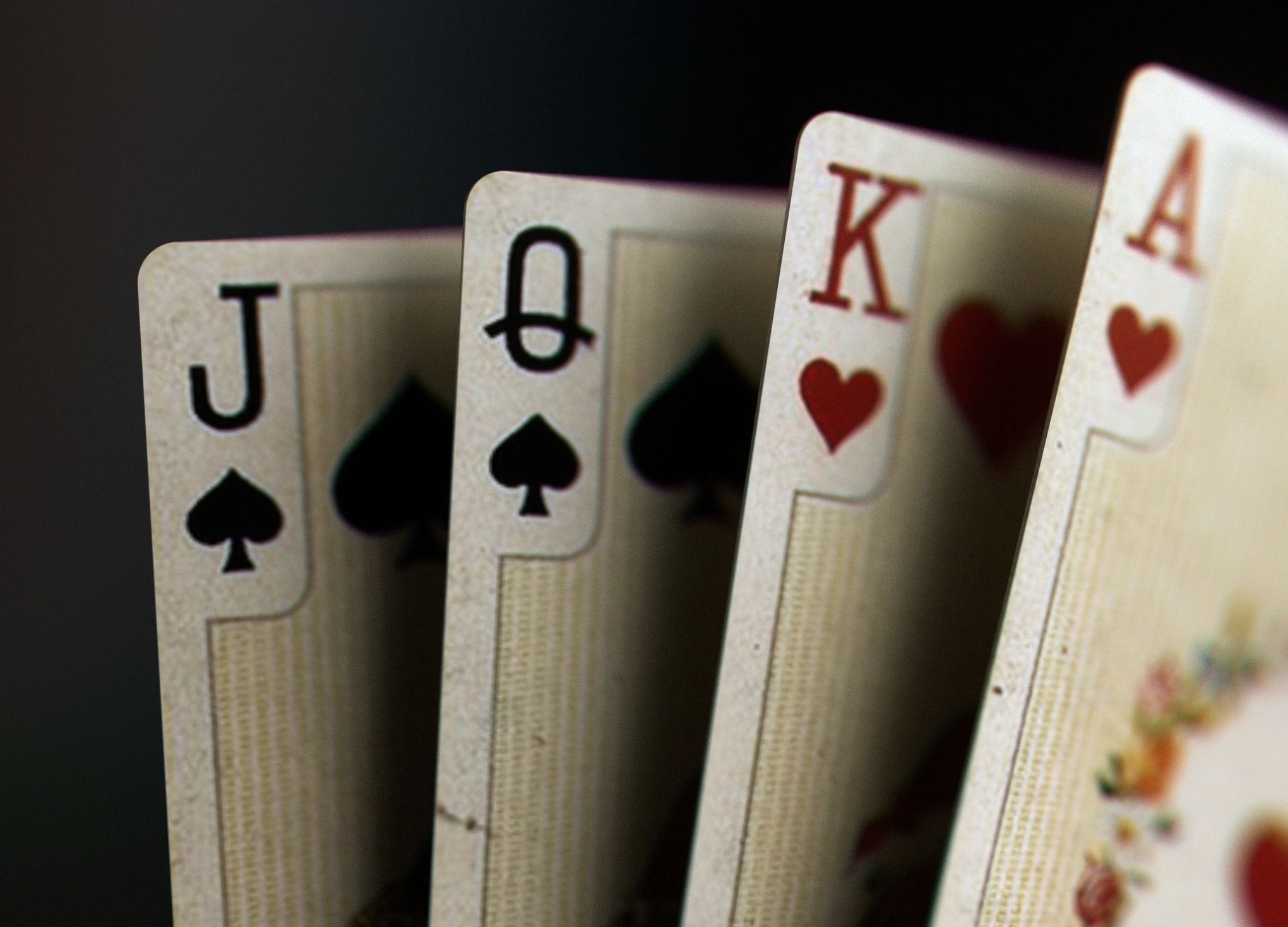 Close-up of playing cards on a dark background